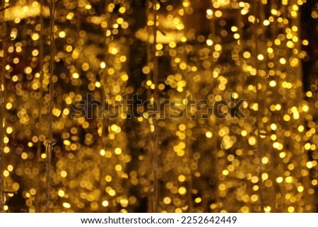 blur bokeh circus tube lamp hang from ceiling in dark room like firefly Royalty-Free Stock Photo #2252642449