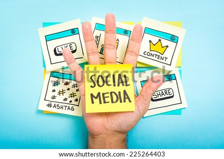 Social media on hand with blue background. Content marketing. Royalty-Free Stock Photo #225264403