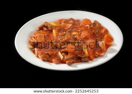 Beef Garlic souce, Is a popular Arabic-Chinese delicacy all over Arabs. Battered sea food, Chinese cuisine pictures, isolated on Black background.