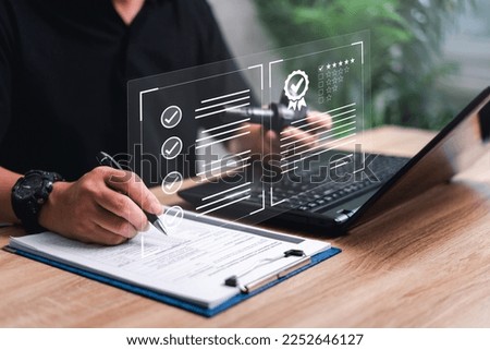 Customer Satisfaction Guarantee concept on virtual screens,Employees use laptop check conditions quality assurance pare part of car in digital document and customer rating to service experience online Royalty-Free Stock Photo #2252646127
