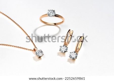 Elegant jewelry set. Jewellery set with gemstones. Jewelry accessories collage. Product still life concept. Ring, necklace and earrings. Royalty-Free Stock Photo #2252659861