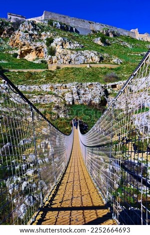 Tibetan bridge suspended over the Gravina canyon which joins the Sassi of Matera with the Murgia in Basilicata, Italy