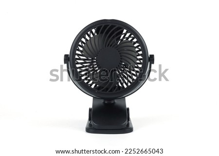 Black portable rechargeable fan isolated on white background. Front view.