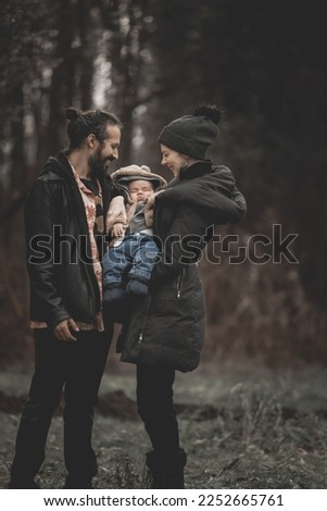 New born family photo shoot in the fall by the woods