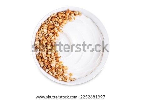 Greek yogurt nuts oatmeal granola in a white bowl on a white isolated background. the toning. selective focus