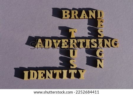 Advertising, Trust, Identity, Brand, Design, words in wooden alphabet letters in crossword form isolated on background