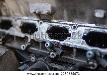Car repair concept. dirty engine Intake car engine Close up manifold ports. Dirty intake manifold. Royalty-Free Stock Photo #2252685673