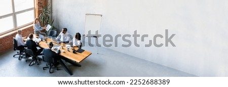 Long Banner With Successful Business Team Having Meeting In Office, Group Of Colleagues Discussing Company Strategy During Conference In Boarding Room, Panorama With Copy Space, Extended Shot