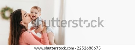 Family Offer. Wide Banner With Happy Mother Kissing Her Adorable Baby, Extended Horizontal Shot Of Loving Young Mom Bonding With Infant Child At Home, Enjoying Motherhood, Panorama With Copy Space Royalty-Free Stock Photo #2252688675