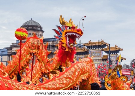 Close up of the beautifully decorated dragon performing its traditional Chinese New Year dragon dance in Liverpool seen in January 2023. Royalty-Free Stock Photo #2252710861