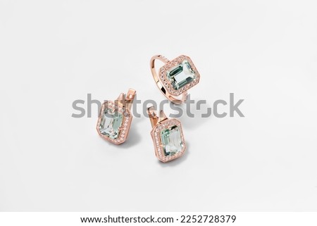 Elegant jewelry set. Jewellery set with gemstones. Jewelry accessories collage. Product still life concept. Ring, necklace and earrings. Royalty-Free Stock Photo #2252728379