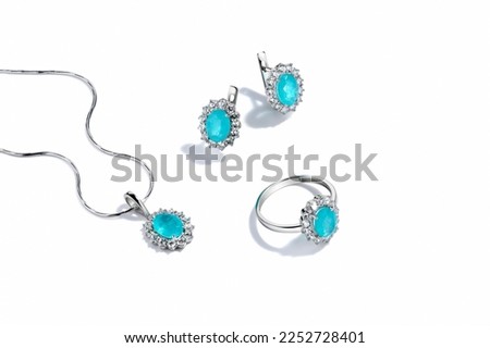 Elegant jewelry set. Jewellery set with gemstones. Jewelry accessories collage. Product still life concept. Ring, necklace and earrings. Royalty-Free Stock Photo #2252728401