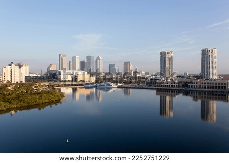 The morning view of calm Ybor Turning Basin waters and Tampa downtown skyline in a background (Florida).