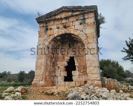 Kanlıdivane is a historical place   consisting of historical buildings around a sinkhole, which dates back to the 4th century. Here, It is possible to see traces of Hellenistic Period, Rome; Byzantine Royalty-Free Stock Photo #2252754803