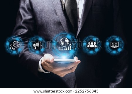 Businessman in suit use smartphone with sign and icon of digital online marketing internet advertising and sales business technology concept, online marketing, E-business, Ecommerce, Business online