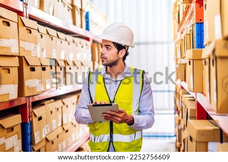 Portrait engineer worker labor man use tablet shipping order detail check goods and supplies on shelves with goods background inventory in factory warehouse.logistic industry and business export