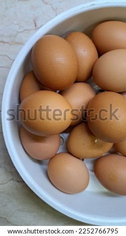 Close up picture of eggs in a white basket