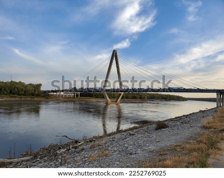Suspension bridge reflecting over the Missouri River 