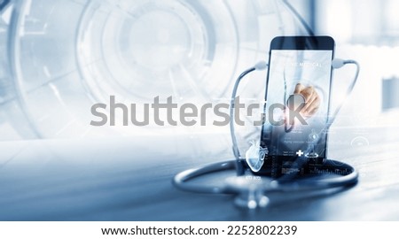  Stethoscope wear with smartphone, Doctor through the phone screen check health. Online medical consultation,Virtual hospital, online medical and medicine clinic connect and communication with patient Royalty-Free Stock Photo #2252802239