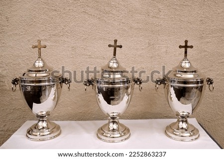 Holy Thursday. Chrism Mass. Holy oils used in the sacraments. Sacred Chrism, the Oil of the Sick and the Oil of Catechumens. France. Royalty-Free Stock Photo #2252863237
