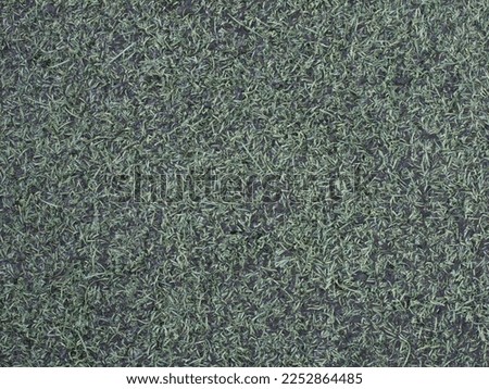 background with wet green synthetic grass texture