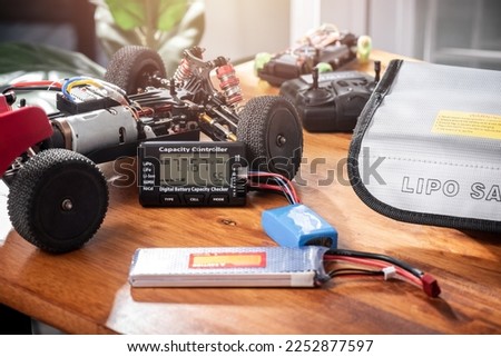 Digital battery capacity checker for LiPo battery. LiPo battery used in RC toy, drone and many electronic device. Royalty-Free Stock Photo #2252877597