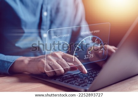 Super Fast internet connection speedtest bandwidth network technology, Man using Internet high speed by smartphone and laptop computer, 5G quality, speed optimization. Royalty-Free Stock Photo #2252893727