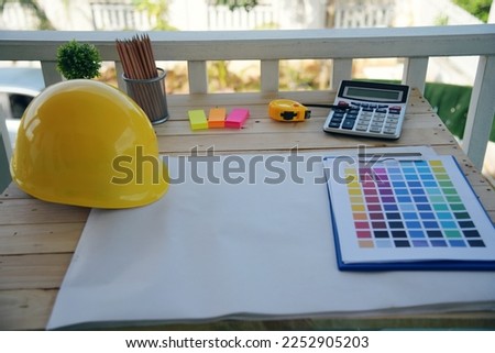 construction engineer office desk architect workplace. engineer drawing objects table with meter, blueprint, hard hat engineering stuff on desk. Designer Objects drafting workplace on wooden table. Royalty-Free Stock Photo #2252905203