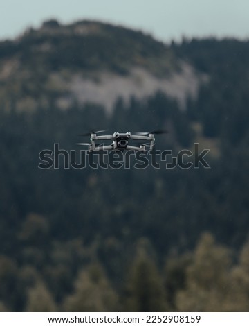drone soaring against the background of the mountains (selective focus)