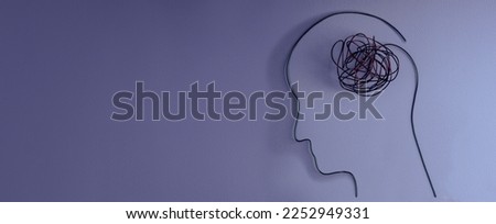 Mental Health Disorder Concept. Weak, Stressed Down Person. Negative Feeling. Depressed Emotional inside a Brain and Mind. Human Head and Brain made by Messy Wire. Top View with Copy Space Royalty-Free Stock Photo #2252949331