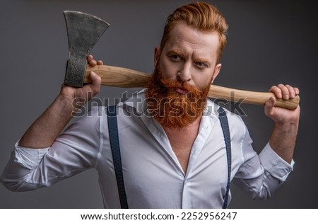 masculinity of man with axe isolated on grey. masculinity of man with axe in studio. Royalty-Free Stock Photo #2252956247