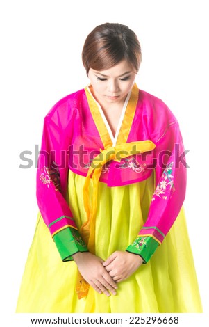 Beautiful woman asian girl hanbok dress korea.Woman in Korean Traditional Dress.Smiling korea woman dress traditional,Woman in hanbok bowing,studio shot isolated on white background.