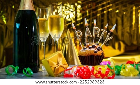 Happy birthday background for any age with champagne glasses with cake with party candles. Beautiful birthday card with decorations copy space.