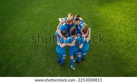 Soccer World Championship: Blue Team Players Happy, Celebrate Victory, Hug, Future Winners Jump in Circle before start of the Game. League Tournament Season Finals. Football Concept. Royalty-Free Stock Photo #2253008811