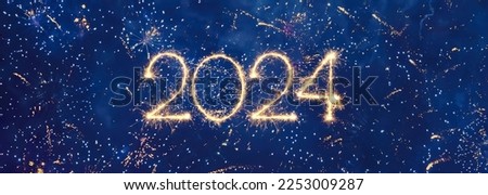 Happy New Year 2024. Beautiful panoramic holiday web banner or billboard with Golden sparkling number 2024 written sparklers on festive blue background