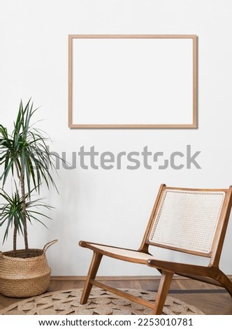 Blank picture frame mockup on a wall. Horizontal orientation. Artwork template in interior design