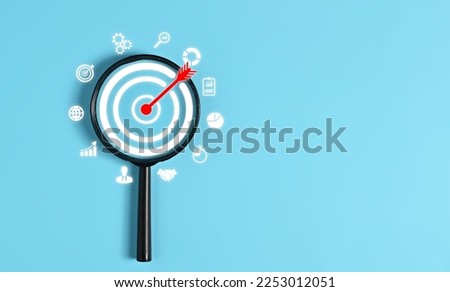hands with target icon, arrow represents creative solution for setting up business objectives and goals, target for business investment and marketing. image suggests the company or individual Royalty-Free Stock Photo #2253012051