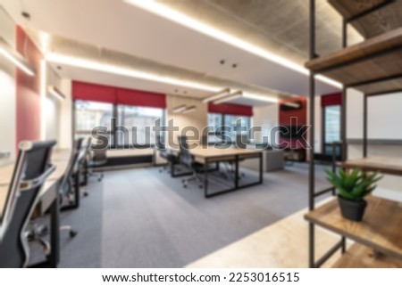 Abstract blur business office working space background with modern style. Blurry creative workplace design background ideal for presentation backgrounds on online meeting.