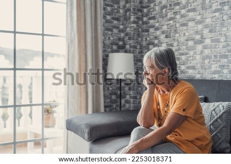 Face of senior caucasian hoary woman looking away deep in sad thoughts feels lonely close up portrait, recollect memories and life moments, depressed grandmother alone indoors, yearning for husband  Royalty-Free Stock Photo #2253018371