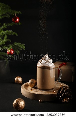 Hot chocolate or coffee with whipped cream served in a cup, front view, winter holidays treats concept Royalty-Free Stock Photo #2253037759