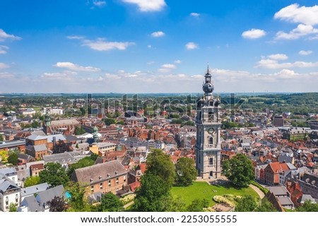 Aerial summer skyline panorama of the old town of Mons (Bergen). The Belfry of Mons (Beffroi de Mons) in the foreground. Wallonia, capital of Hainaut, Belgium.  Royalty-Free Stock Photo #2253055555