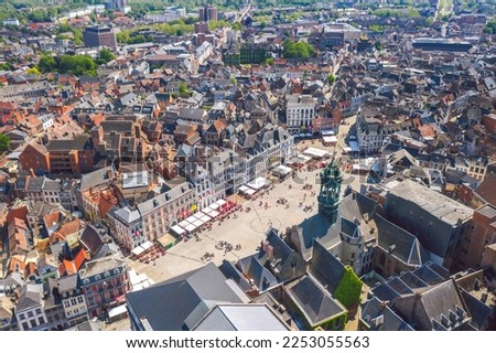 Aerial skyline summer view of vibrant central square (Grand-Place de Mons) and town hall of Mons (Bergen). Wallonia, capital of Hainaut, Belgium.  Royalty-Free Stock Photo #2253055563