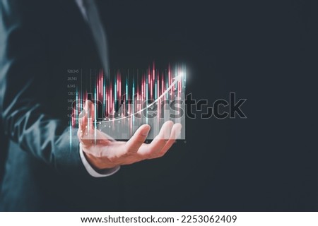 concept of investment planning and strategy, Stock market, Business growth, progress or success concept. Businessman or trader is showing a growing virtual hologram stock, invest in trading.