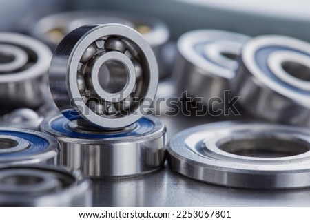 different bearings on a metal background. Part of mechanism. Royalty-Free Stock Photo #2253067801