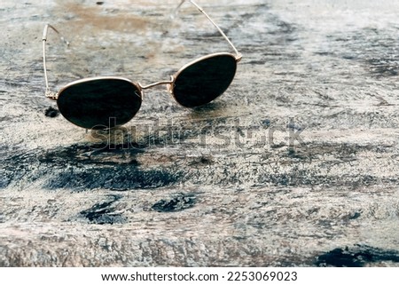 Sunglasses on wooden table summer concept