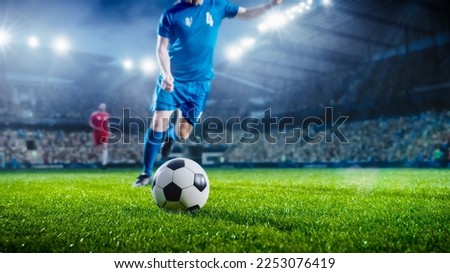 Football World Championship: Soccer Player Runs to Kick the Ball. Ball on the Grass Field of Arena, Full Stadium of Crowd Cheers. International Tournament. Cinematic Shot Captures Flawless Victory.