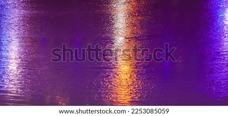 Ice rink texture with colorful lights reflections, abstract background photo