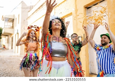 Brazilian Carnival. Group of friends celebrating carnival party Royalty-Free Stock Photo #2253103555