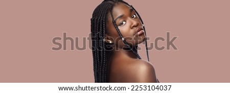  Portrait of young woman with dreadlocks  Royalty-Free Stock Photo #2253104037