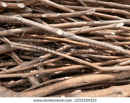 Close up bundle sticks branches. Close up of large pile of sticks branches. A bundle of dry sticks and branches. Branches pile isolated. Royalty-Free Stock Photo #2253104323